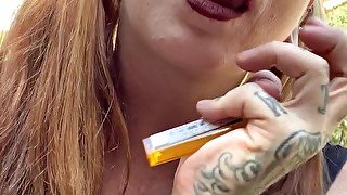 Horny Redhead Seductively Smokes