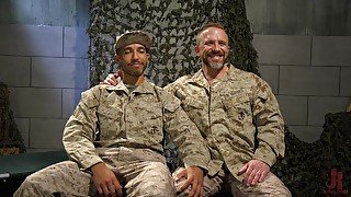 Kinky bondage gay session with an interracial army men couple