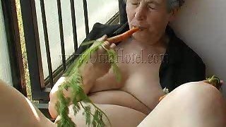 Super horny granny fucks her loose pussy with a carrot