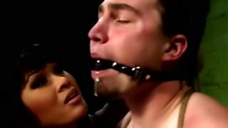 Asian dominatrix punishing her slave