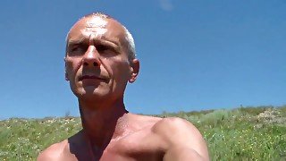 Amateur gay porn shows old dude posing in the outdoors