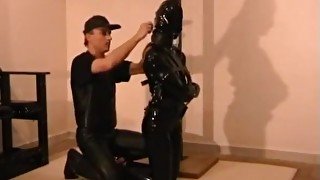 Heavy rubber straitjacket bondage