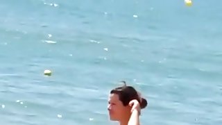 Topless cute girl on the beach is filmed on my voyeur tape