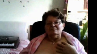 naughty granny flashing her big tits on cam