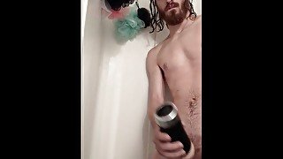 Young man in the shower with his toy