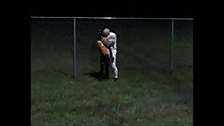 Football player catches surfer at fence after night practice