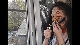 zombie makeup, smoking a cigarette