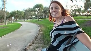 Redhead Lindsey fondles her tits and rides big dick