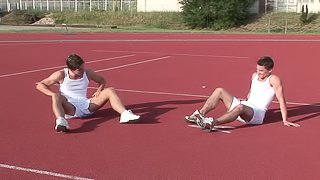 Two gay cuties having oral sex on the stairs until one gets creamed