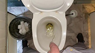 Pissing without hands in an office public toilet from an uncut penis. POV 4K