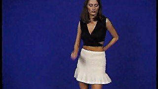 Brunette teen dancing and taking her clothes off