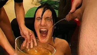 Slender brunette takes a big dick in her ass and gets drenched in piss