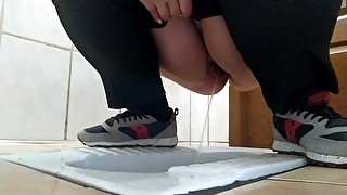 Curvy MILF pissing in a dirty public toilet