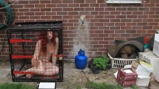 Nude woman in cage
