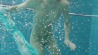 Podvodkova swimming in blue bikini in the pool