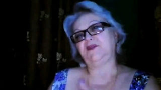 Russian granny ex-teacher flashing her big tits on  webcam