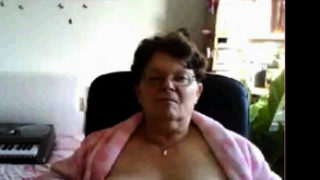 naughty granny flashing her big tits on cam