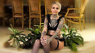 Tattooed short haired beauty Leigh Raven backstage interview