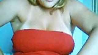 A slutty Brazilian blondie in red dress shows it all on webcam