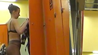 Spy cam in the locker room catches sexy brunette girl in the buff