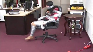 Angry girl taped to chair