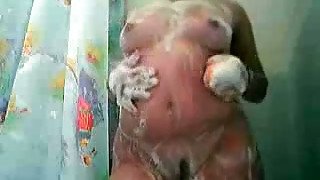 Amateur BBW takes a shower on cam and rubs her soapy pussy passionately