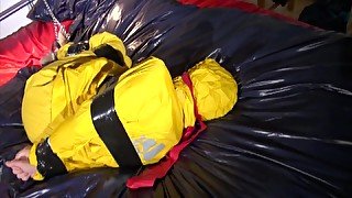 Get 2 Archivevideos With Sonja Enjoying Bondage In Her Shiny Nylon Rainwear