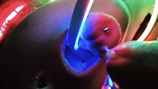 Her illuminated throat receives sperm