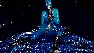 Heavy rubber goddess with big tits in transparent blue latex catsuit and mask masturbates - part 4