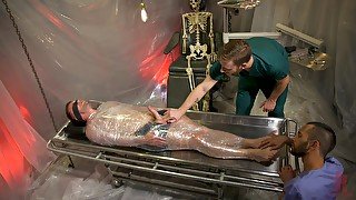 Kinky gay dude wrapped in plastic with only his dick out for sucking