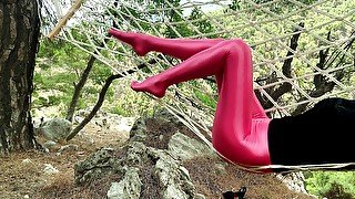 Rose spandex pantyhose on a hammock in the mountains