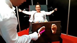 Mainstream woman feet tickling in stocks