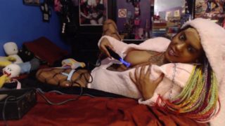 Cute submissive black girl playing with violet wand toy