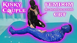 Femdom Goddess whips balls of mummified slave