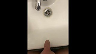 Extra small penis pissing in a sink with no hands being very high (compare)