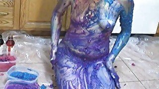 Teen chick strips and plays in puddle of body paint on the kitchen floor