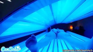 teen latina gets caught rubbing her clit while using a tanning bed