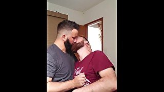 Two men kissing