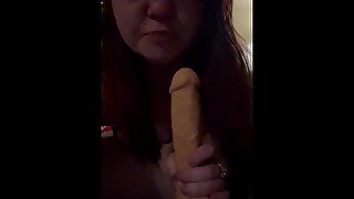 Sucking a giant dildo