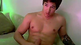 Handsome young jock Jizzy McBone masturbates hard dick solo