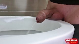 Uncircumcised cock peeing with a big stream