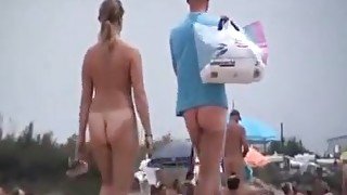 Nude beach with couples playing