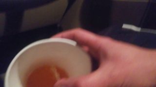 Pissing into a Mc Cup