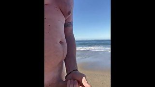 Walking along a nude beach with my cock in my hand