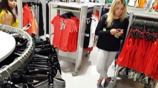 Candid hot blonde in leggings shopping